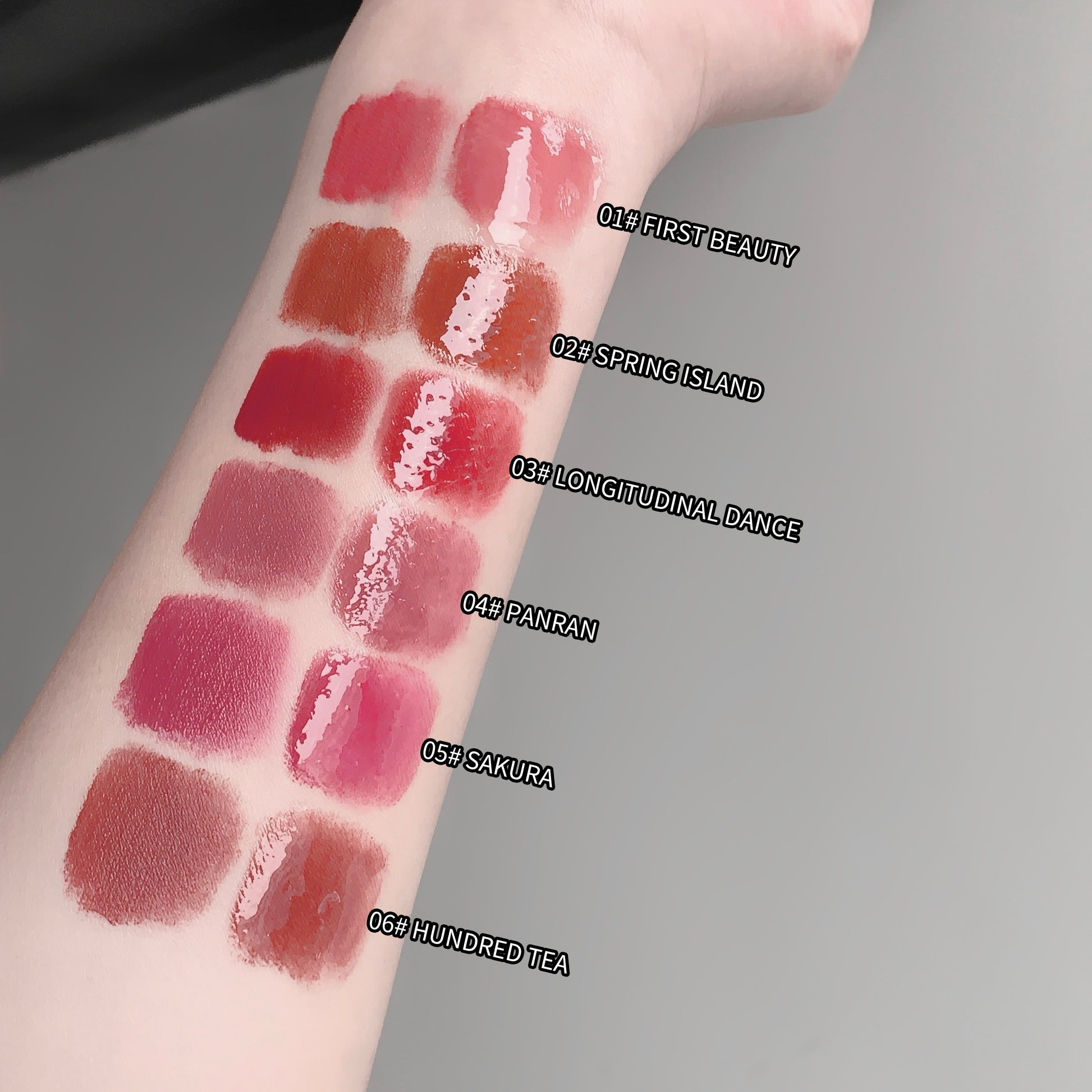 Lipstick swatches on a person's arm with color names labeled