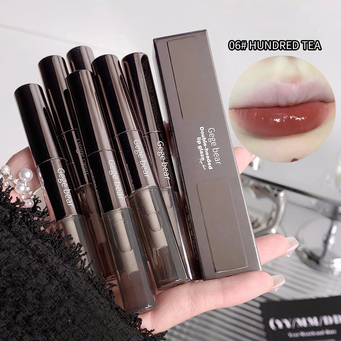 Set of Geee Bear lip products including lip gloss and packaging, with a close-up of a lip wearing the product.