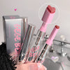 Pink and clear lipsticks with a close-up of the pink lipstick cap, GEGE BEAR packaging in the background.
