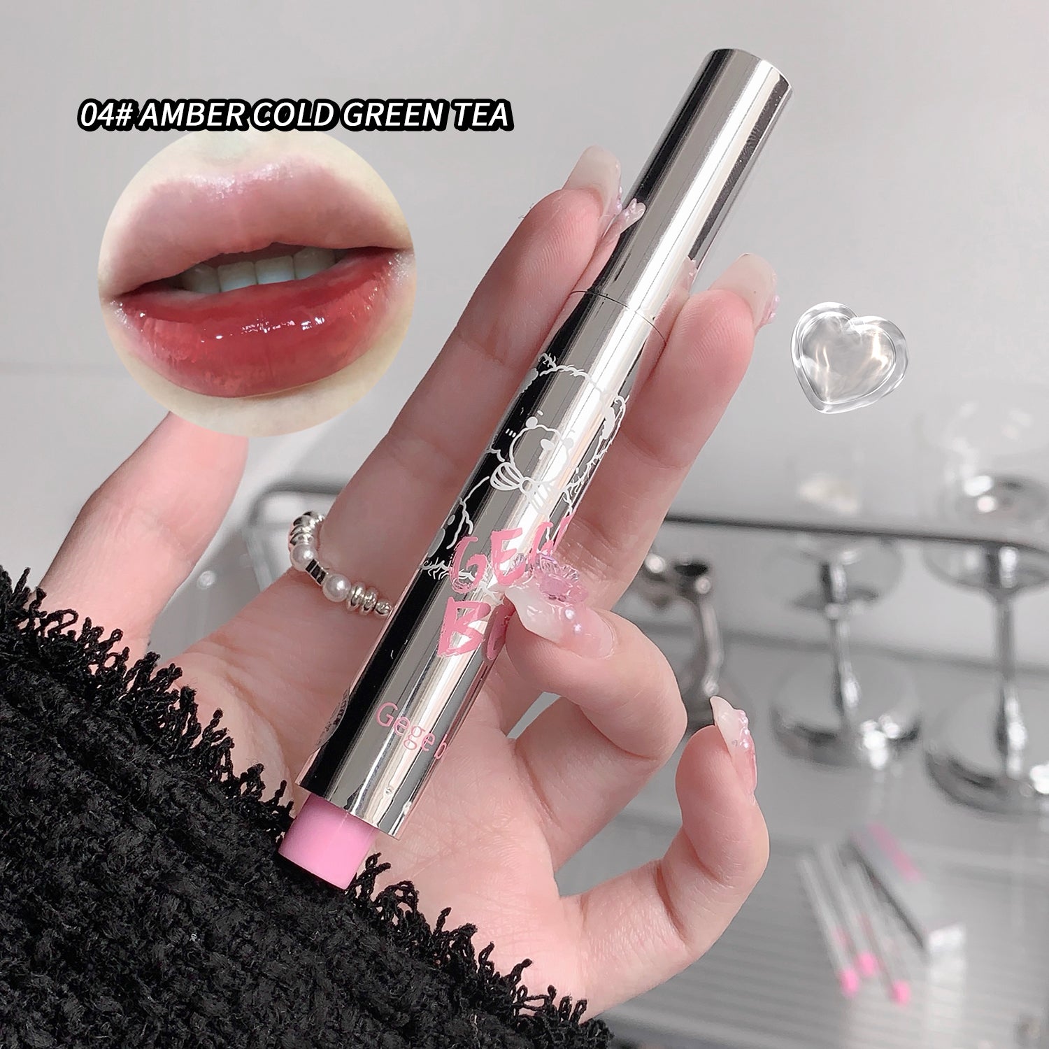 Hand holding a lip gloss with close-up of lips and product details.