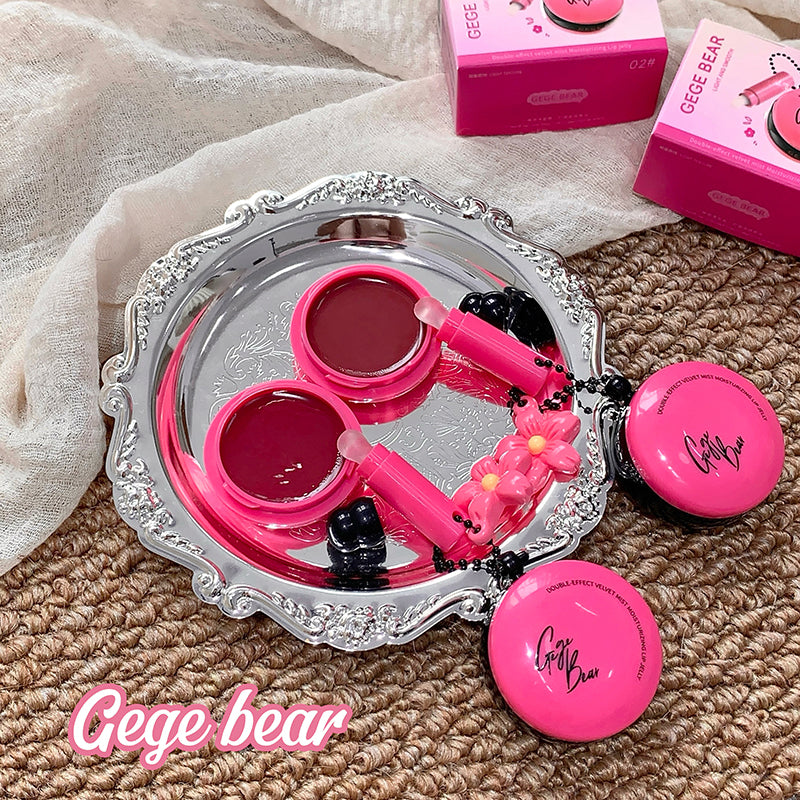 Pink makeup set with a silver tray on a textured surface, featuring 'Gege bear' branding.
