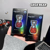 Two Gege Bear lip gloss packages held by a hand with a blurred background.