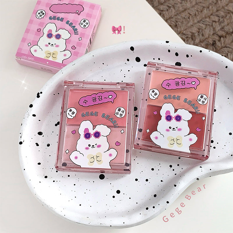 Two pink boxes with cartoon bear design on a white plate