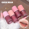 Five GEGE BEAR lip and cheek purpure creams on a textured surface with a close-up of lips.