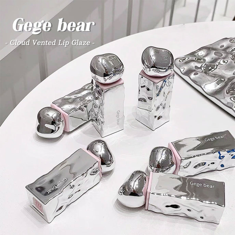 Silver and pink cosmetic products with 'Gege bear' branding on a white surface.