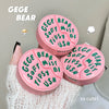 Three pink containers with green text labeled 'GEGE BEAR' on a light gray background.