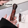 Brown lip gloss held in a hand with 'Gege Bear' branding, against a white background.