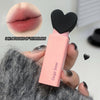 Pink lipstick with heart-shaped cap held by a hand, close-up of lips shown with '04# A Touch of Vermilion' text.