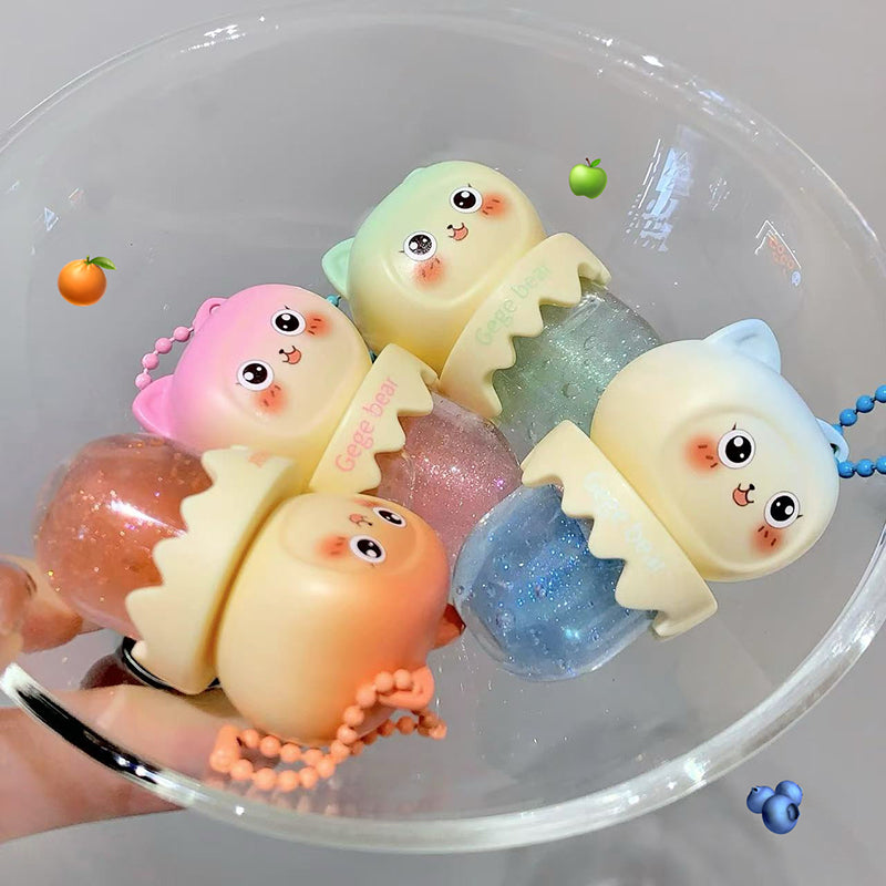 Colorful jelly-like toys with cartoon faces in a clear bowl.