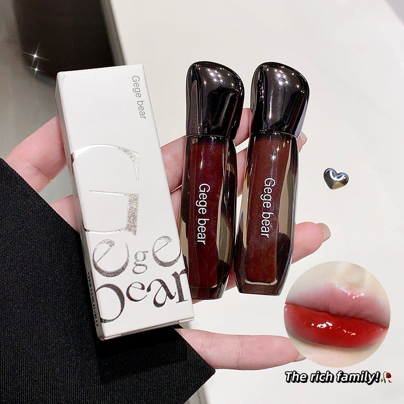 TwoGege bear lip products held by a hand with a close-up of the product on a white background.