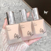 Three Gege Bear foundation bottles held in a hand with a blurred background