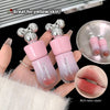 Two pink lip glosses with silver tops held by a hand, with a close-up of lips wearing the product and text indicating it's great for yellow skin.