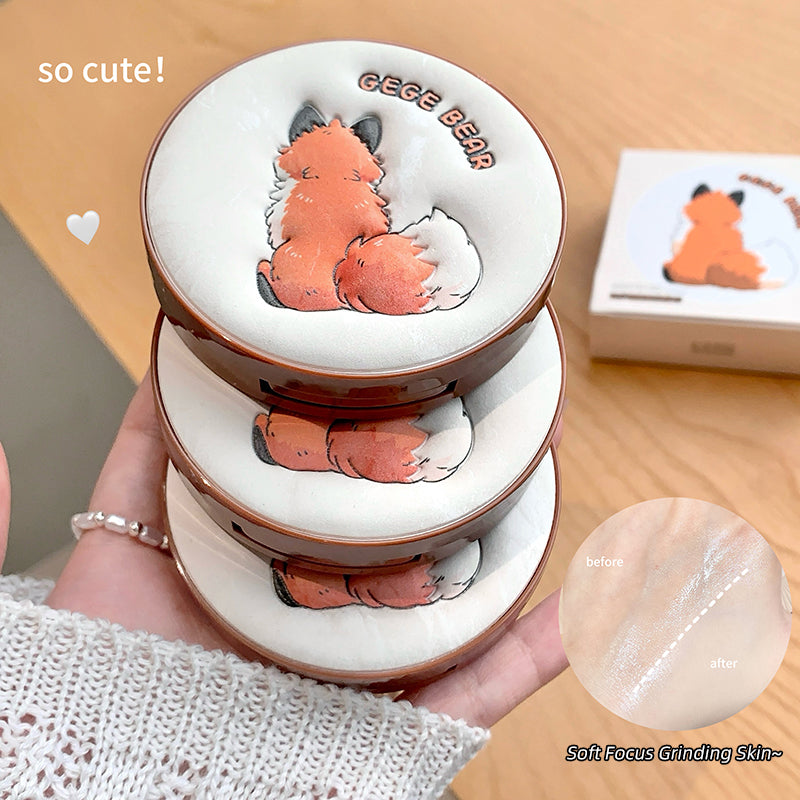 Stack of small ceramic containers with fox illustrations on a wooden surface.