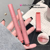 Pink mist lipstick pen held by a hand with a blurred background