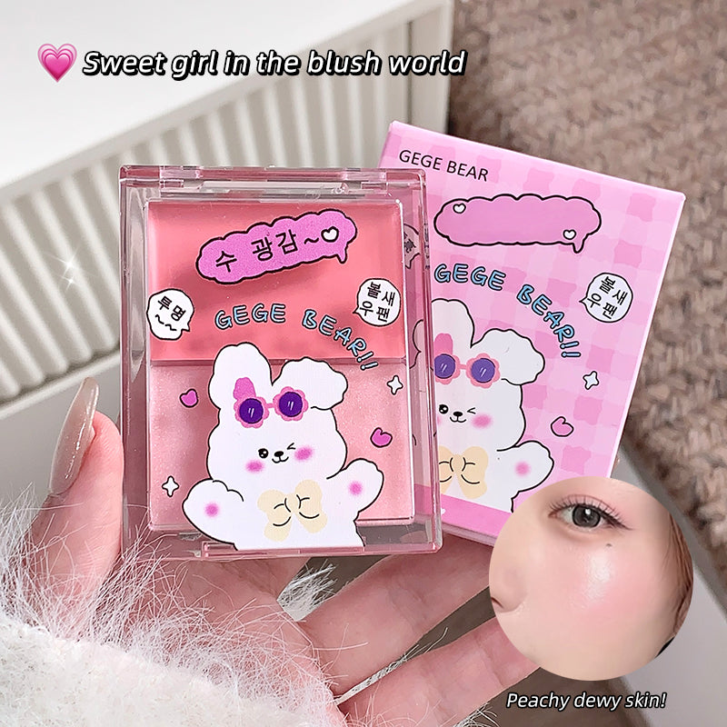 Two pink GEGE BEAR makeup products held by a hand, with a close-up of peach-colored skin.