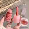 Pink lip gloss with applicator held by a hand, brand 'Gegebear' visible