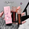 Two lipsticks with a pink box labeled 'Gege bear' held by a hand.