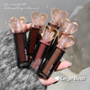 Hand holding multiple Gege Bear lipsticks with a textured surface background