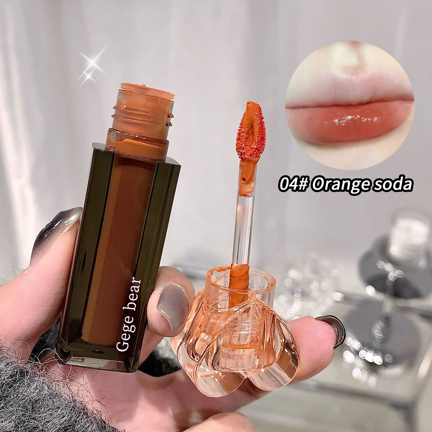 Lip tint with applicator and 'Gege bear' branding, showing color swatch on lips.
