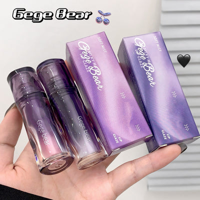 Purple cosmetic products with 'Gege Bear' branding held in a hand against a neutral background.