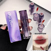 Purple cosmetic product with packaging and application on lips.
