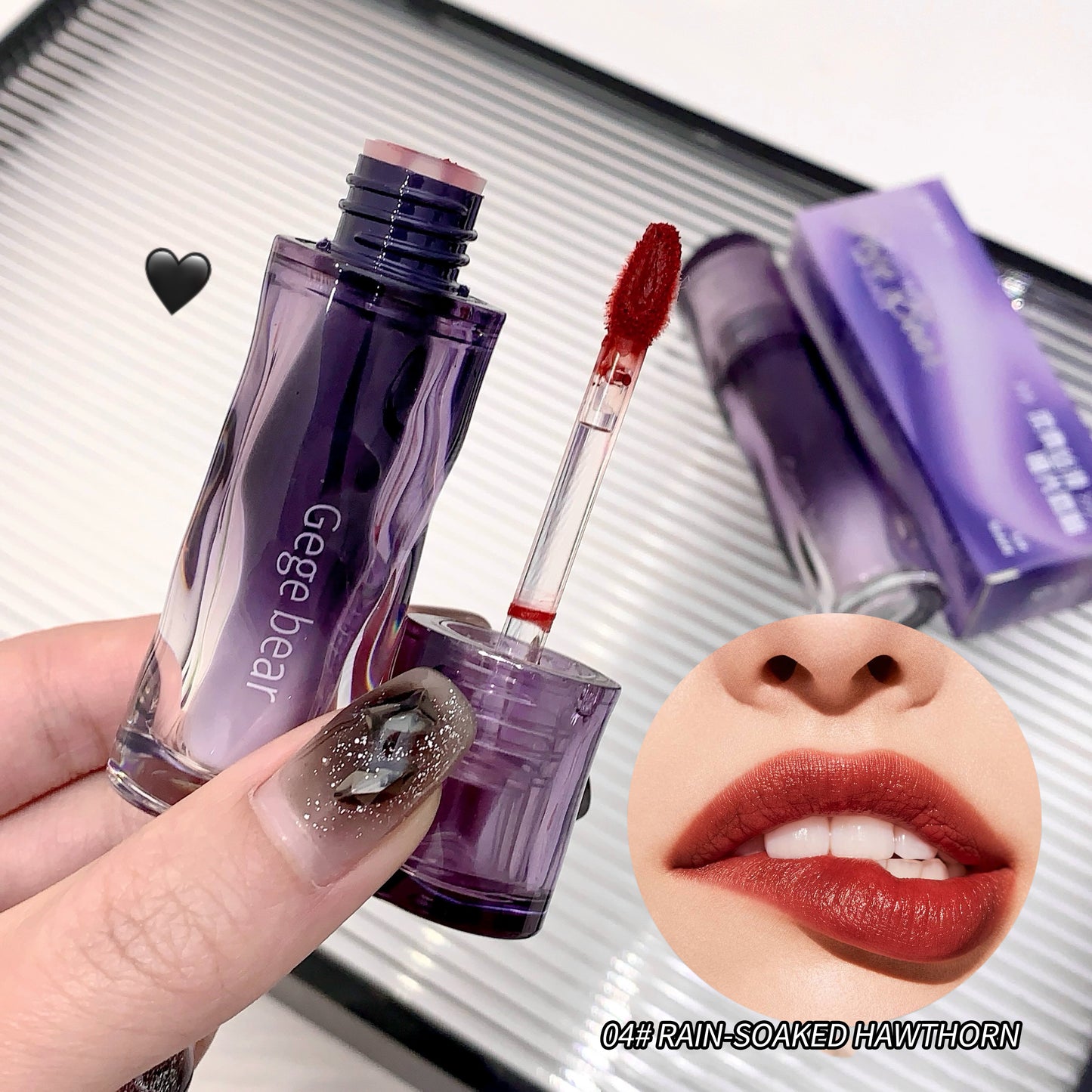 Purple lip gloss with applicator held by a hand, close-up of lips wearing the gloss, and product packaging.