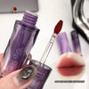 Purple lip gloss with applicator and close-up of lips wearing the product