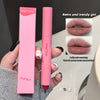 Pink lipstick with packaging held by a hand, showing close-up of lips wearing the lipstick.