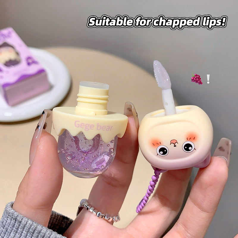 Two small bottles with cartoon designs held by a hand, labeled 'Suitable for chapped lips!'.