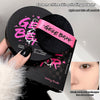Setting powder with GEGE BEAR branding held by a hand, with a close-up of an eye.