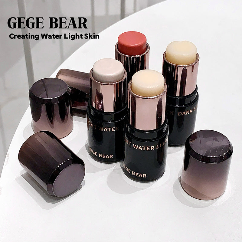 Makeup sticks with visible brand 'GEGE BEAR' on a white surface.
