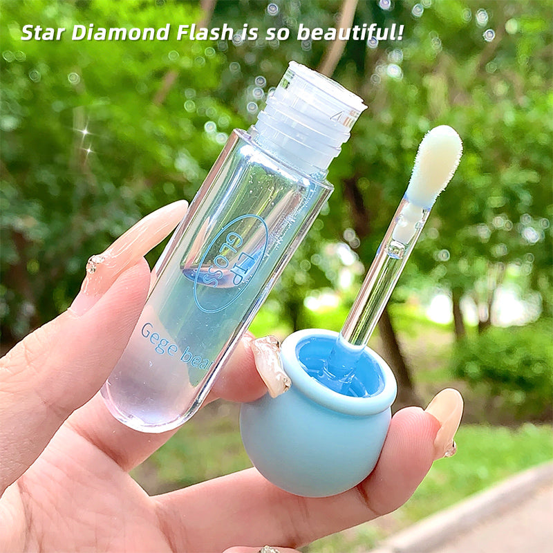 Hand holding a small cosmetic bottle with a brush and container outdoors