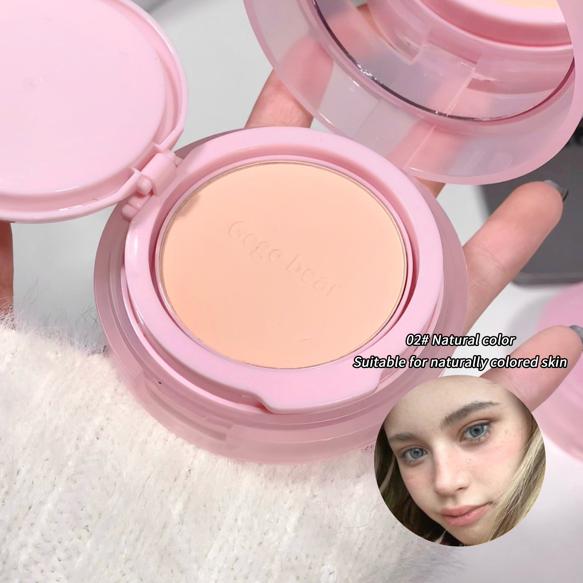 Compact powder in a pink case with a close-up of a person wearing it.