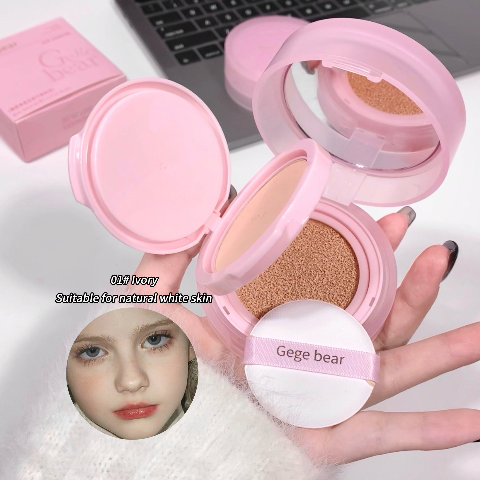 Pink compact powder with a mirror and puff, held by a hand, on a white background.