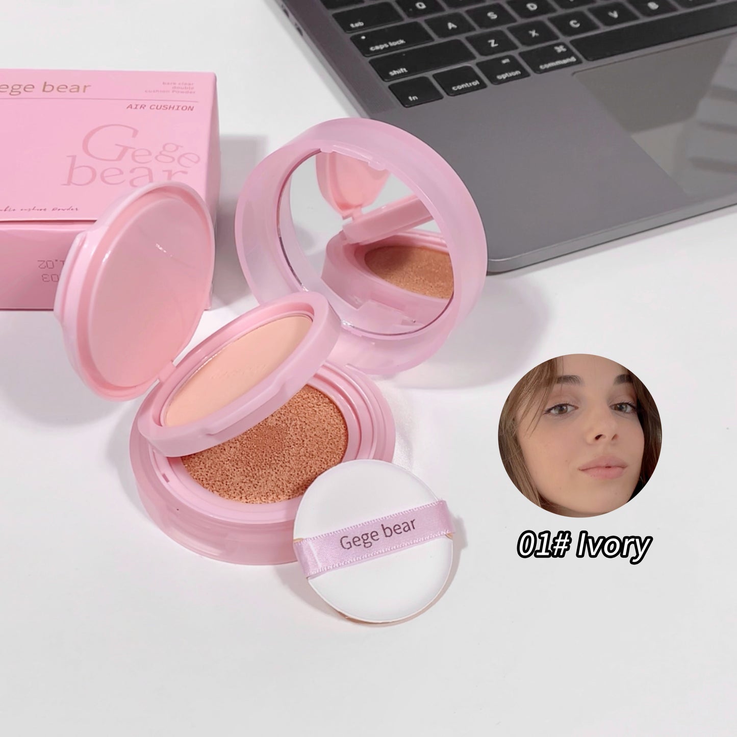 Pink Gege bear cosmetic compact with open lid on a white surface, next to a laptop.