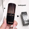 Black nail polish bottle with 'GEGE BEAR' branding held by a hand, next to its packaging on a white background.