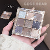 Makeup eyeshadow palette held in a hand with 'GEGE BEAR' branding.