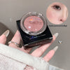 Hand holding a compact of 'Gaga bear' multi-purpose powder with an inset of skin texture.