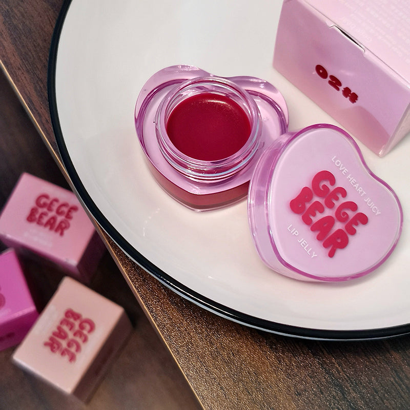 Pink heart-shaped lip jelly with 'GEGE BEAR' branding on a white plate.