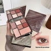 Makeup palette with 'Cige Bear' branding, held by a hand, with an inset of an eye wearing the makeup.