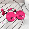 Pink round containers with black text on a metal rack, branded 'Geege Bear'.