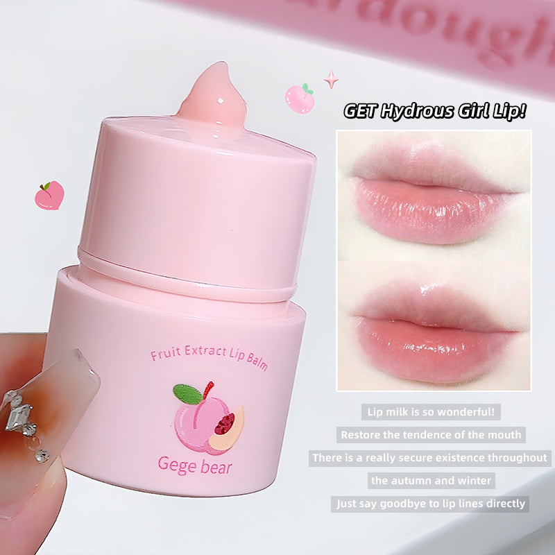 Pink lip balm with peach design and text on a white background
