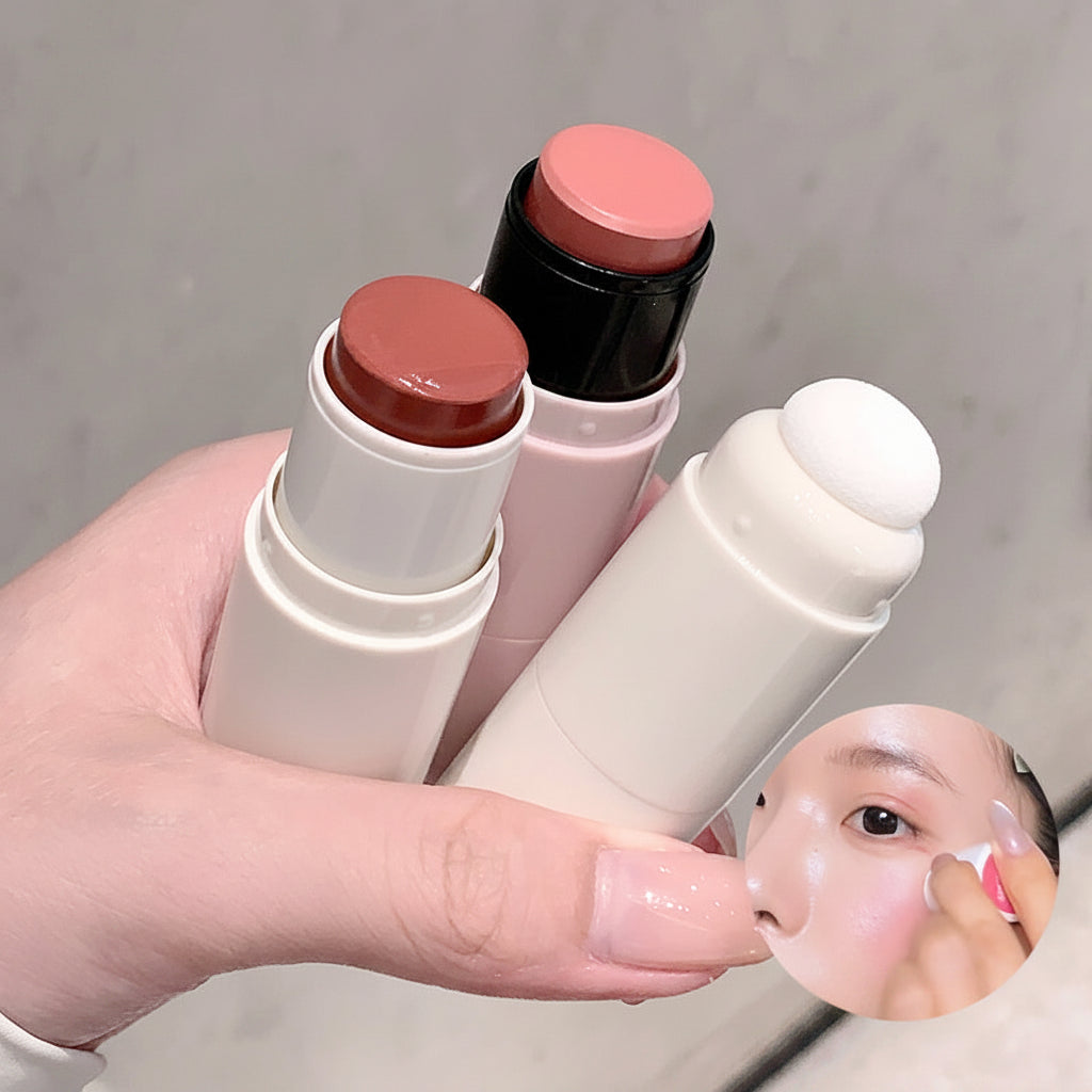 Three cosmetic sticks with sponge applicators held by a hand, with text indicating 'NEW! Porcelain light is great' and 'Comes with sponge head'.