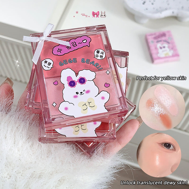 Pink cosmetic compact with cartoon bear design held by a hand, on a white background.