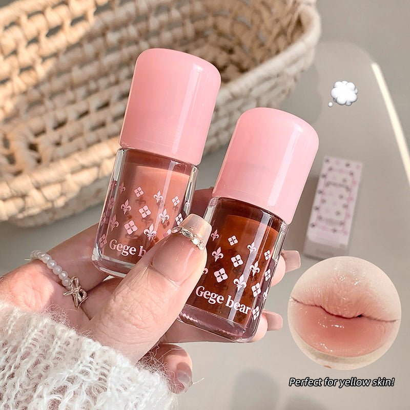 Two small bottles of nail polish with pink caps held by a hand, with a close-up of lips labeled 'Perfect for yellow skin' in the corner.