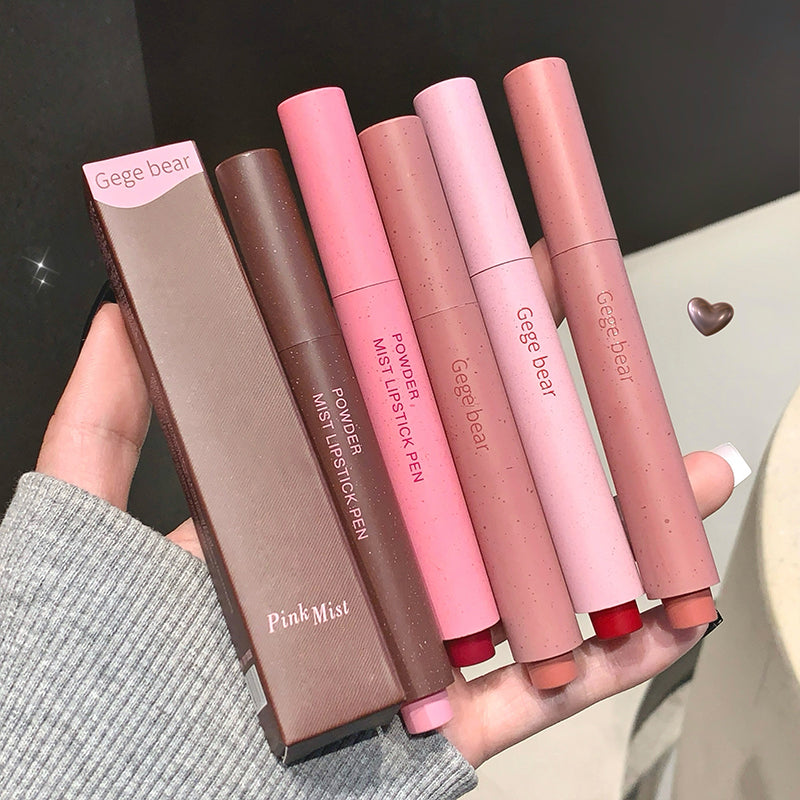 Set of Gege bear powder mist lipstick pens in various shades held by a hand.