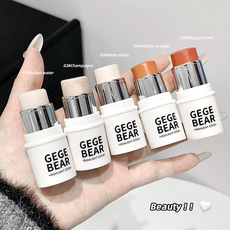 Hand holding multiple GEGBEAR highlight sticks with different shades.