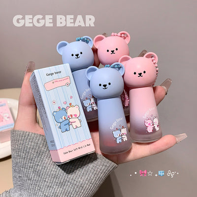 Two bear-shaped bottles and their packaging held in a hand, with 'GEGE BEAR' branding.
