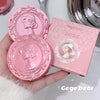 Pink makeup compact with decorative lid and matching box held by a hand, brand 'Gege bear' visible.