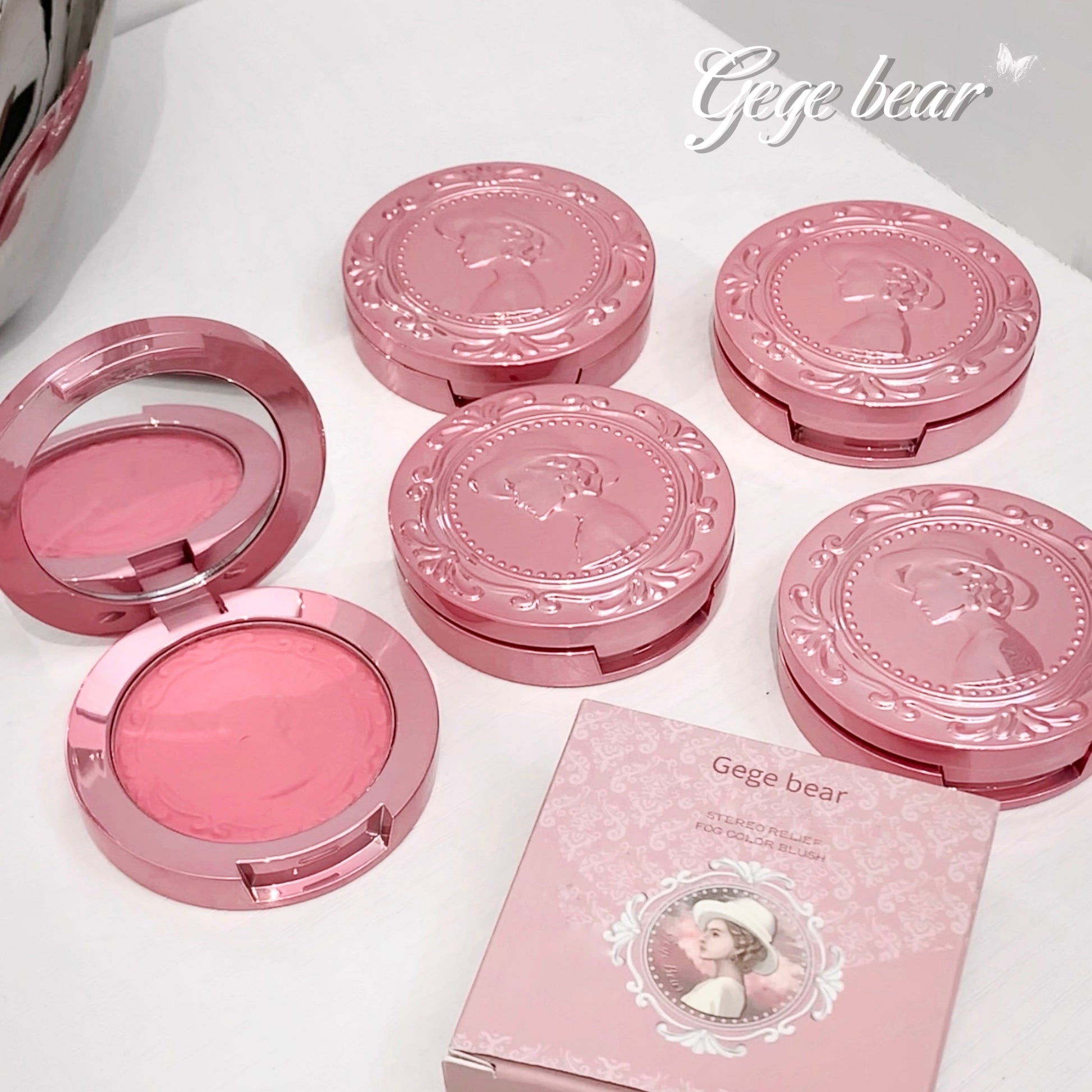 Pink makeup compact with 'Gege bear' branding on a white background